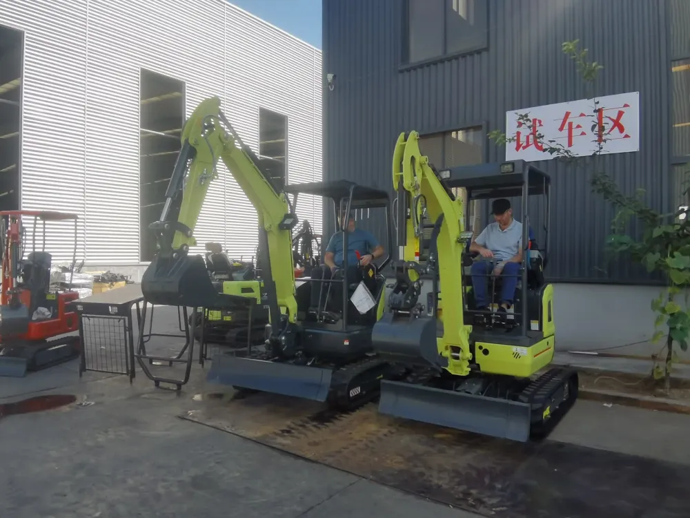 Two mini excavators being tested side by side, one operated by the visiting buyer and one by factory staff