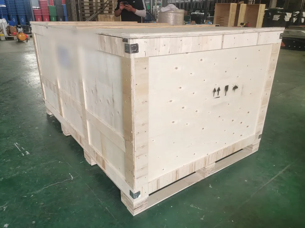 Finished plywood export crates standing on the workshop floor, packed and ready for the truck